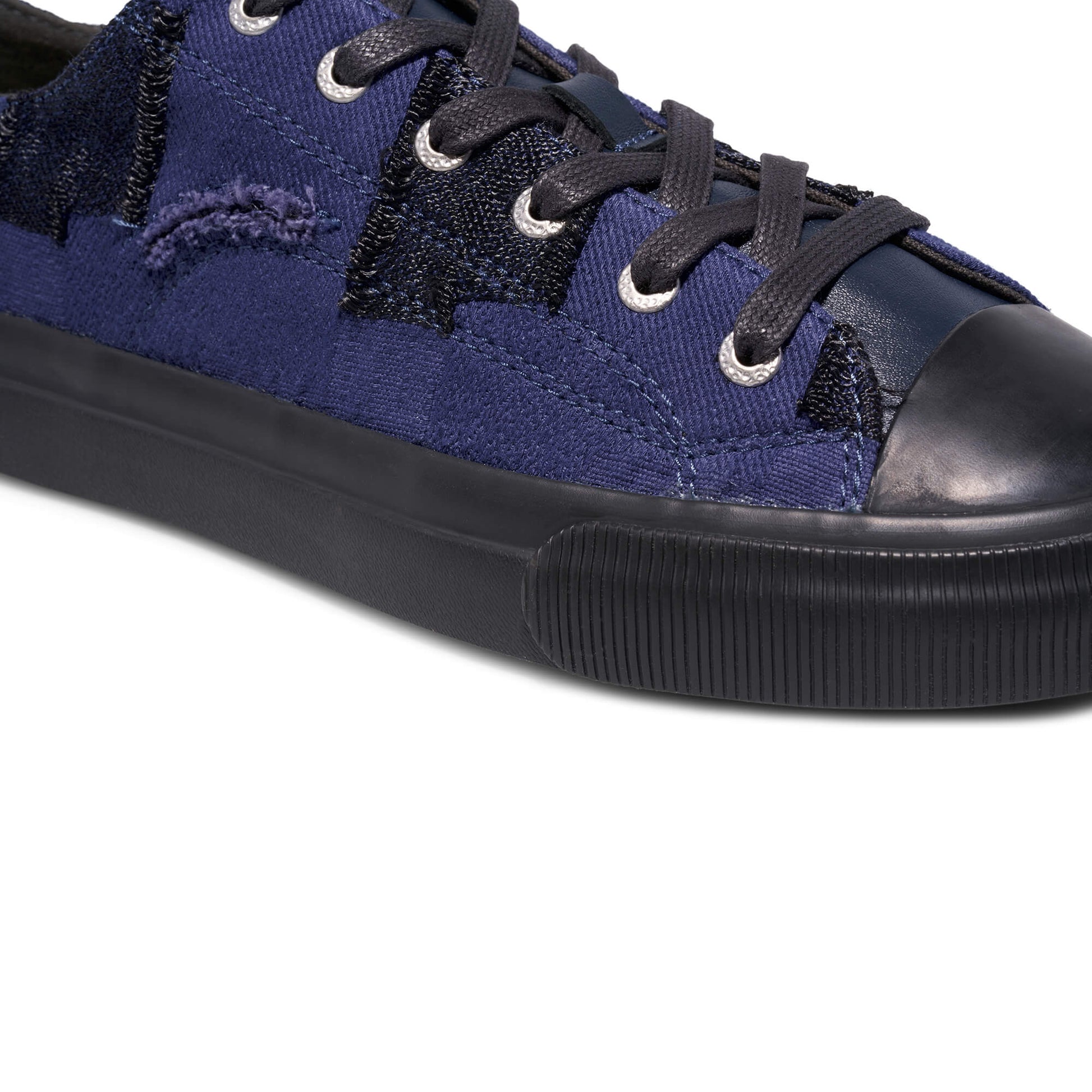 Blue sneaker with black accents on a white background