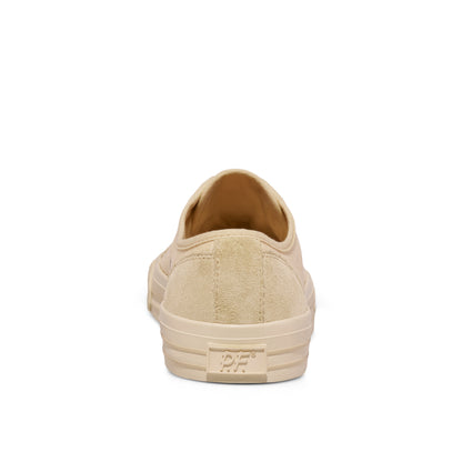 Beige low-top sneaker on a white background.