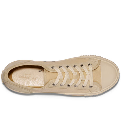 Overhead view of a beige low-top sneaker on a white background.