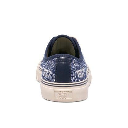Navy blue glittery sneaker with white sole on a white background
