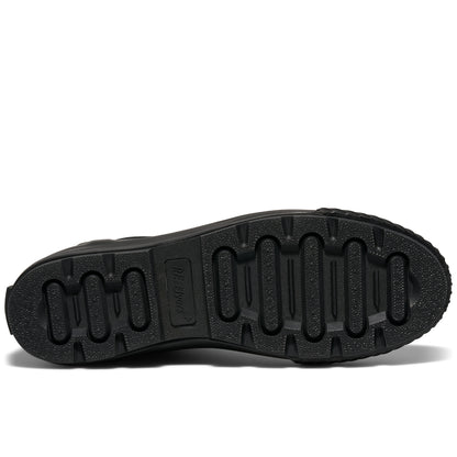 A shoe's black rubber outsole set against a plain white background.