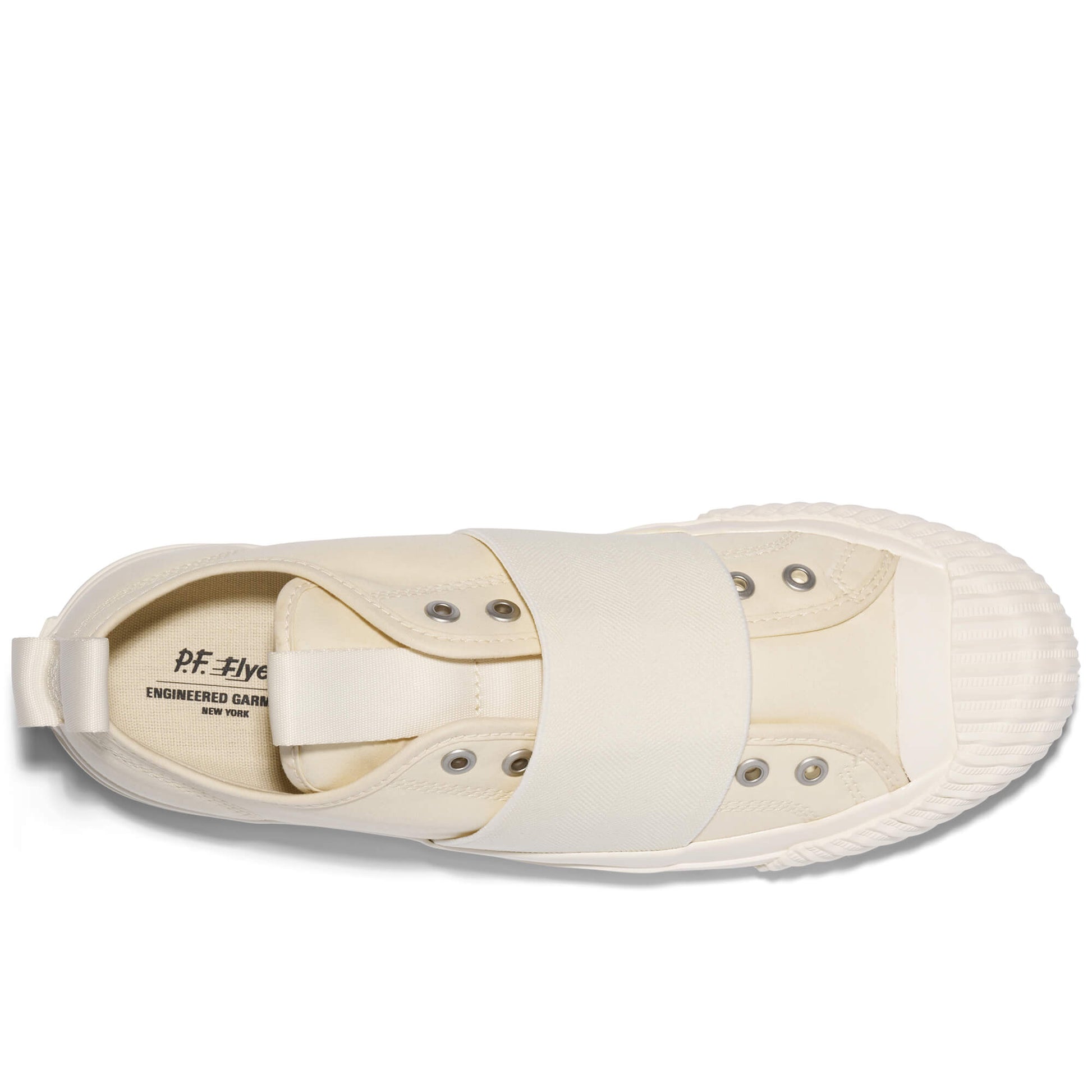 Beige slip-on sneaker with brand label on a white background