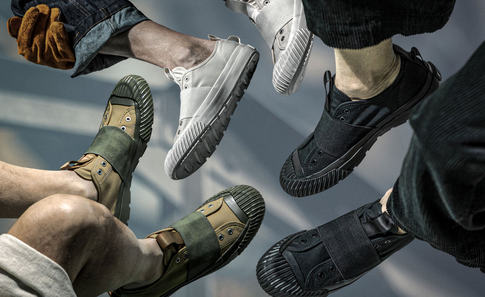 Multiple pairs of shoes in various colors and styles on a neutral background