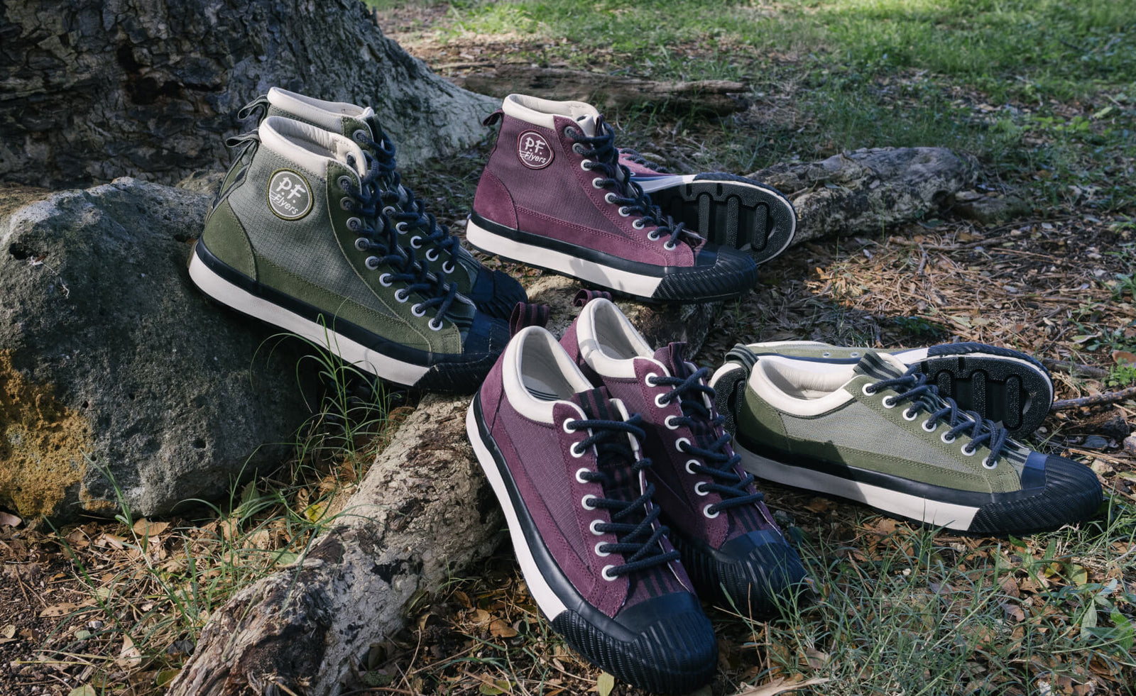 Four pairs of sneakers in green, purple, and black on a natural background.